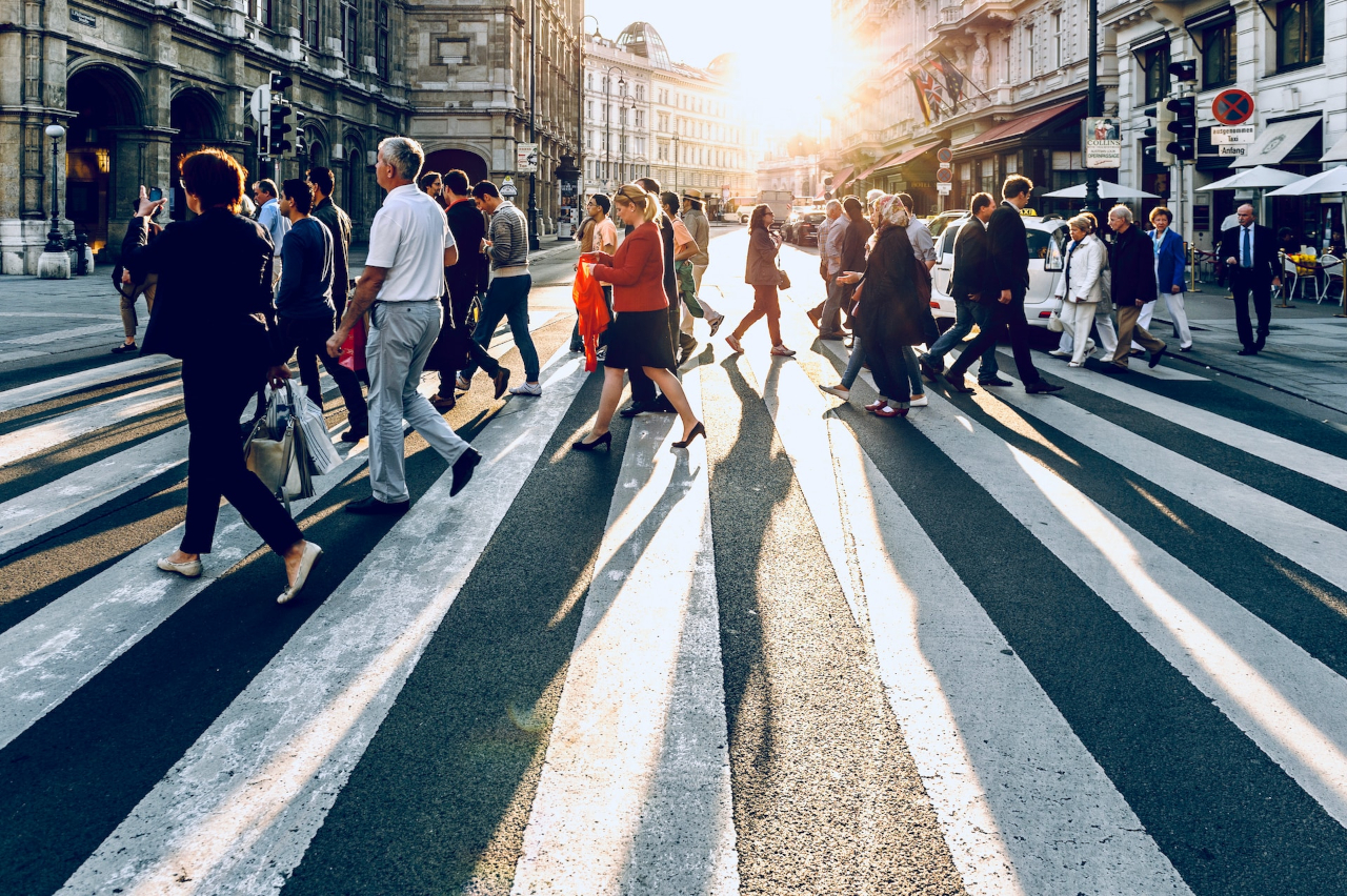 An image showing people of different ages and demographics on a crosswalk, emphasizing understanding the audience.