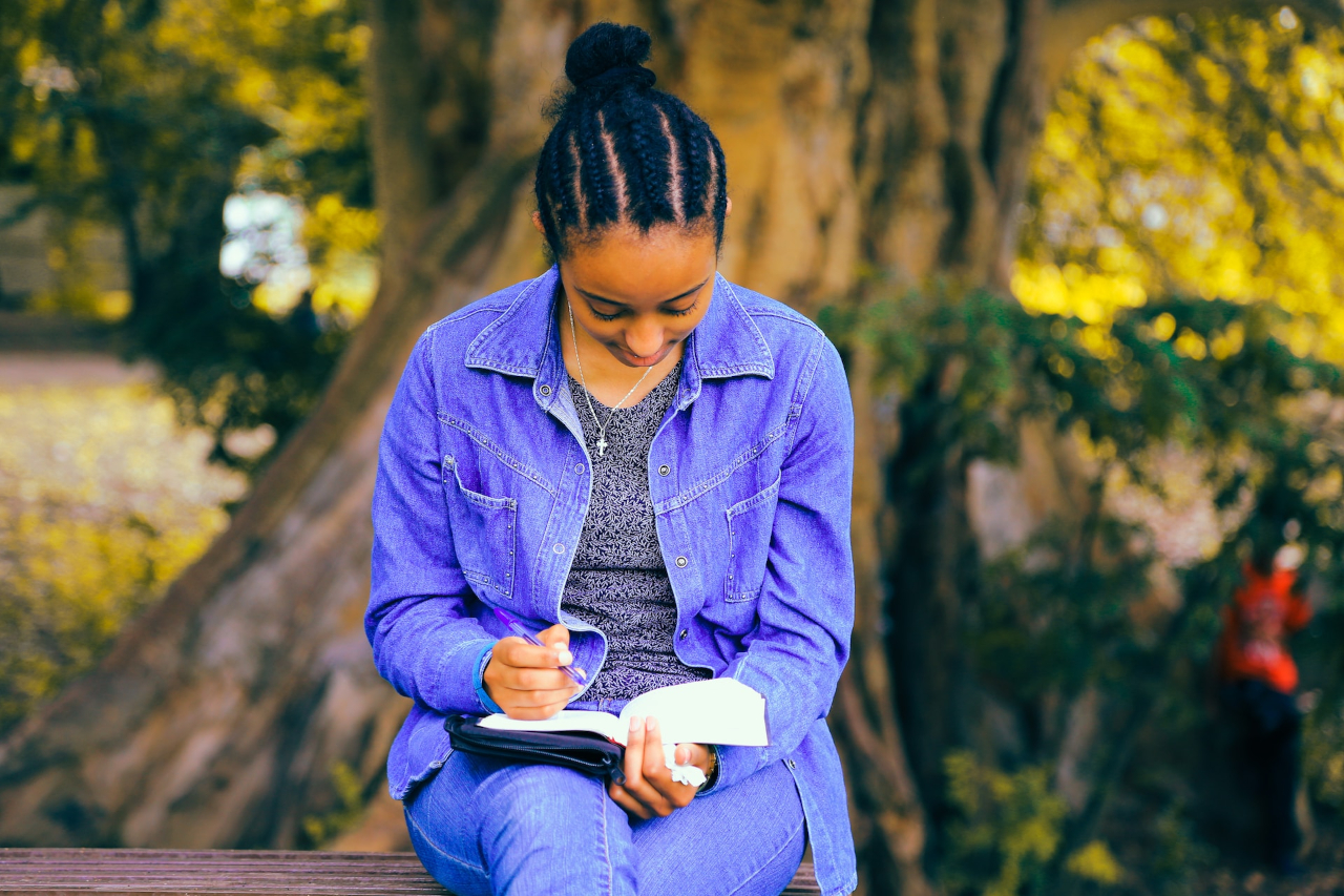 Image of a person reading a book or studying, representing continuous learning.