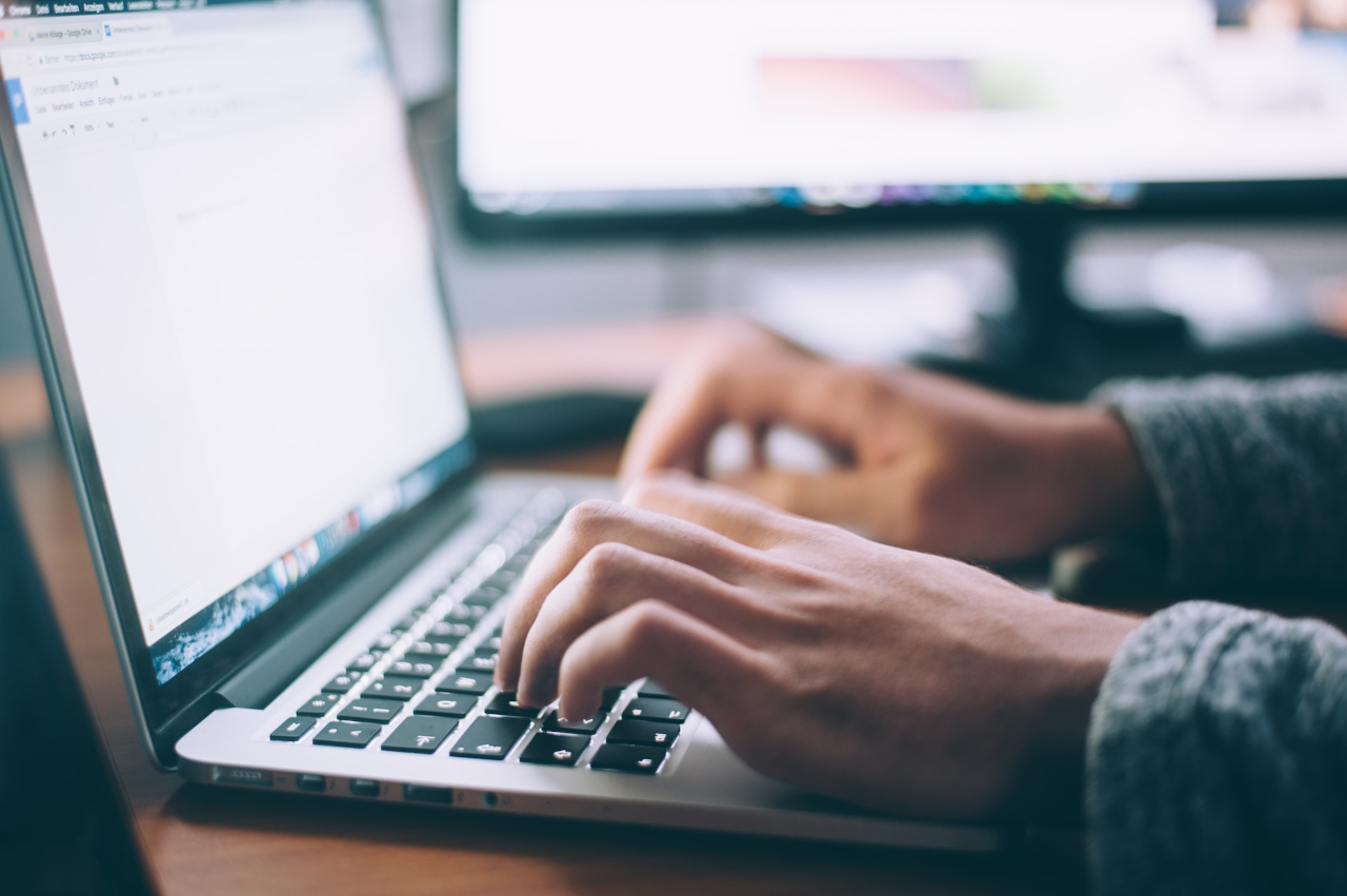 A photo of a person typing on a laptop keyboard, representing starting their Amazon affiliate journey.