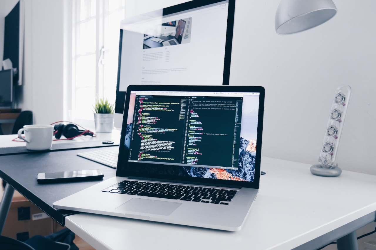 An image of a laptop with code on it showcasing content creation.