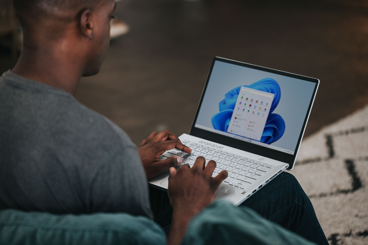 A person using a Windows Surface Laptop.